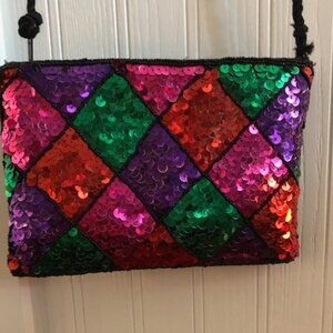Sequined purse measures 8"x6"
